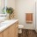 Bath with dual vanity, large mirror and glass enclosed shower