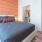 2 Bedroom Luxury Apartments In Old Town Scottsdale, AZ - Formation - Large Bed, An Open Walk-In Closet, Well-Lit, Bedside Table, And Lamp.