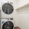 Two Bedroom Luxury Apartments In Old Town Scottsdale, AZ - Formation - Clean Laundry Closet, White Walls, Wood-Style Flooring, Minimalist Design, And High Shelf.